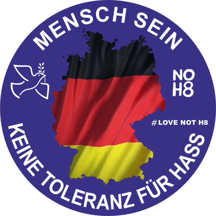 Grafik einer Deutschlandkarte mit der deutschen Flagge und dem Text 'Mensch sein, keine Toleranz für Hass'.