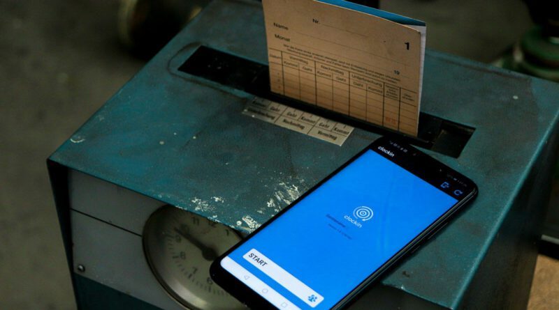 a cell phone sitting on top of a metal box